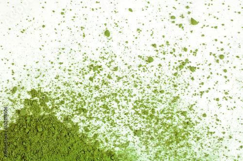 Heap of powdered matcha tea on a white background. Top view.