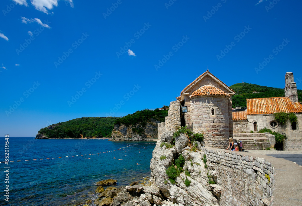 Fortress in the city of Budva on the background of the Adriatic Sea and the sky.