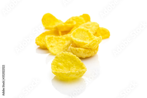 Cereals breakfast. Healthy Superfood corn flakes isolated on white background. Healthy eating, dieting and detoxication concept, space for text. Macro close-up shot.