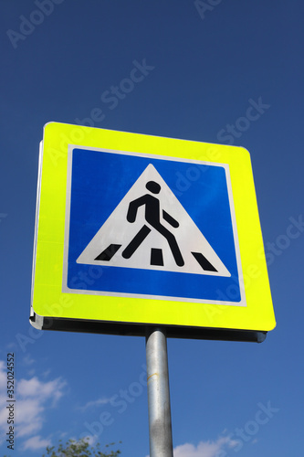 Russian road sign warning of pedestrian crossing ahead 