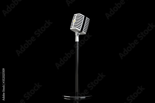 Vintage microphone on a black background. 3D render