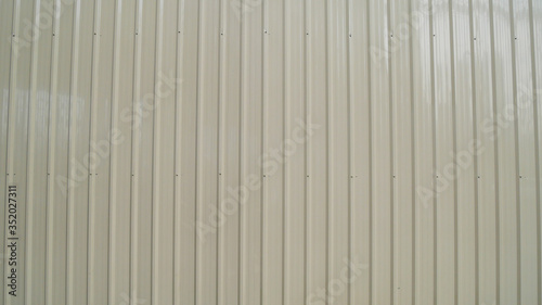 White vintage corrugated metal or zinc texture surface or galvanize steel in the vertical line background or texture