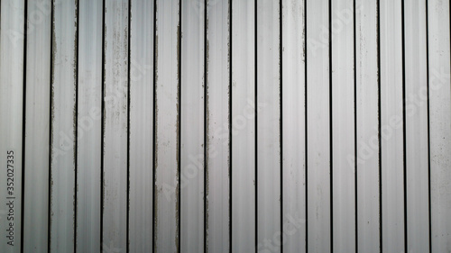 White vintage corrugated metal or zinc texture surface or galvanize steel in the vertical line background or texture