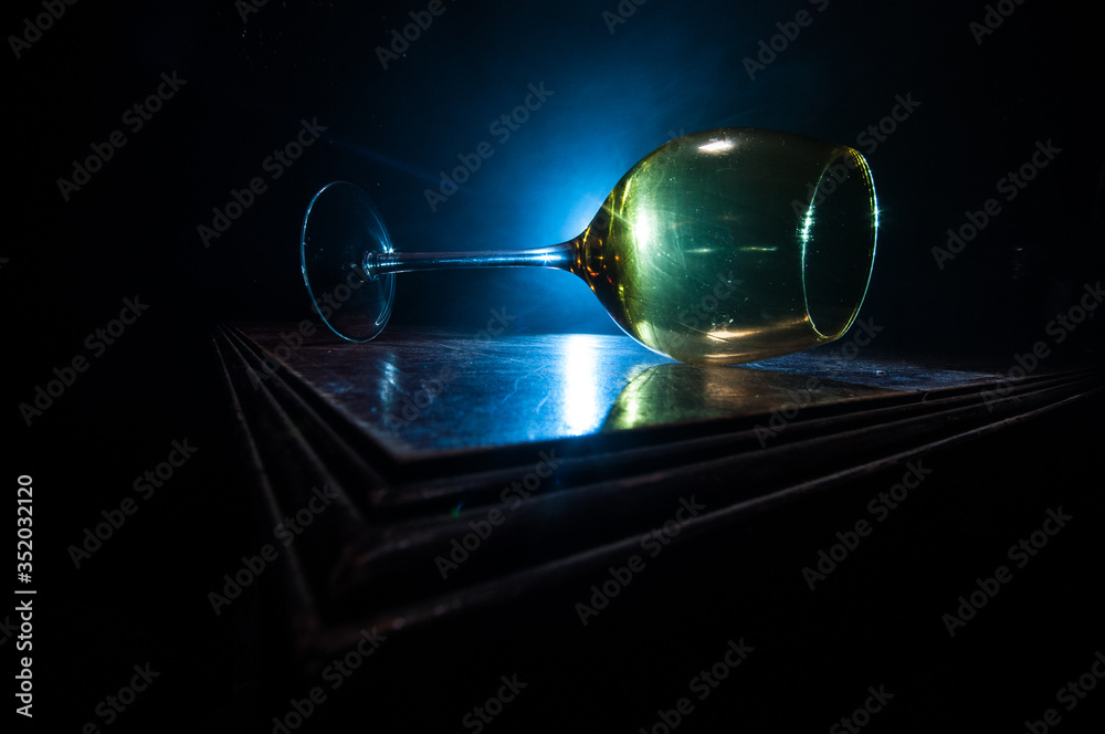 Goblet of white wine on wooden table on wooden wall background Goblet of white wine on wooden table on wooden wall background
