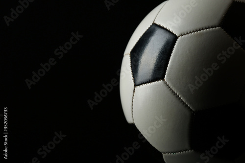 soccer ball on black background.   classic football ball with copy space