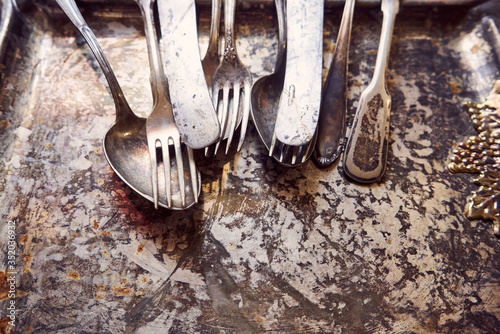 Antique cutlery. table setting in vintage style. Antique fork, old knife, spoon. Space for recording, antique dishes.