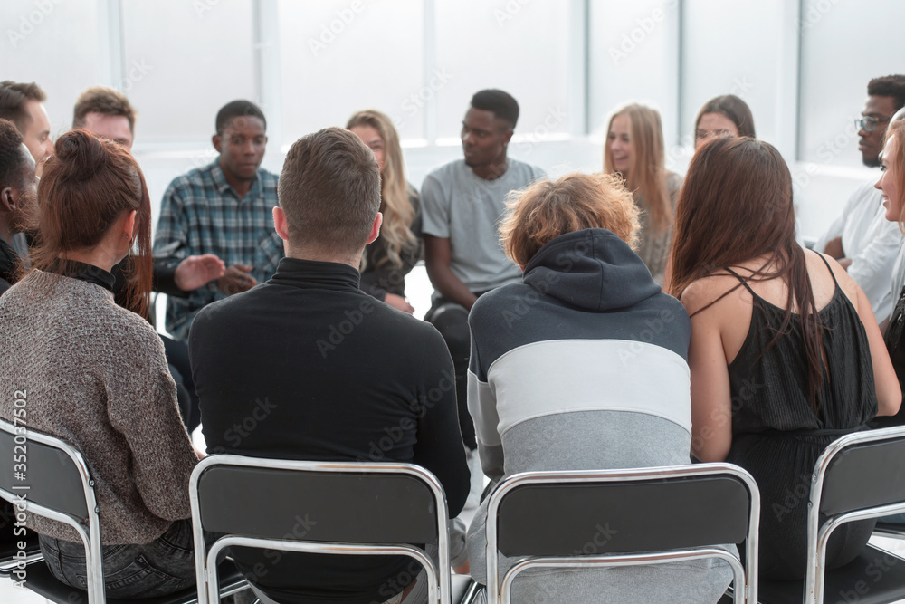 close up. a group of diverse young people sitting in a circle