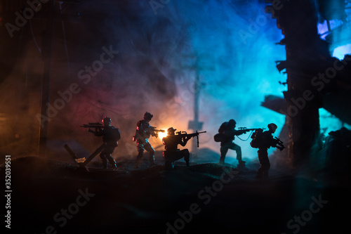 War Concept. Military silhouettes fighting scene on war fog sky background  World War Soldiers Silhouette Below Cloudy Skyline At night.