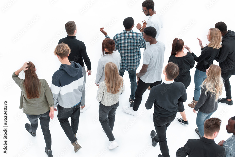 group of diverse young people pointing somewhere up