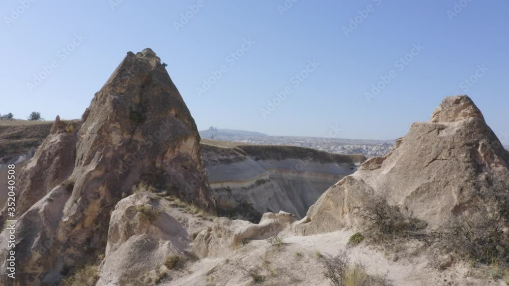 Volcanic rocks in Cappadocia, Turkey. Aerial view of amazing landscape of famous rock formations. Volcanic rocks in Cappadocia, Turkey. Aerial view of amazing landscape of famous rock formations.