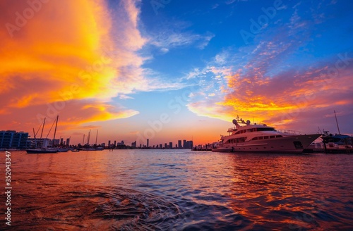 sunset over the sea miami florida orange boat ocean water beautiful 