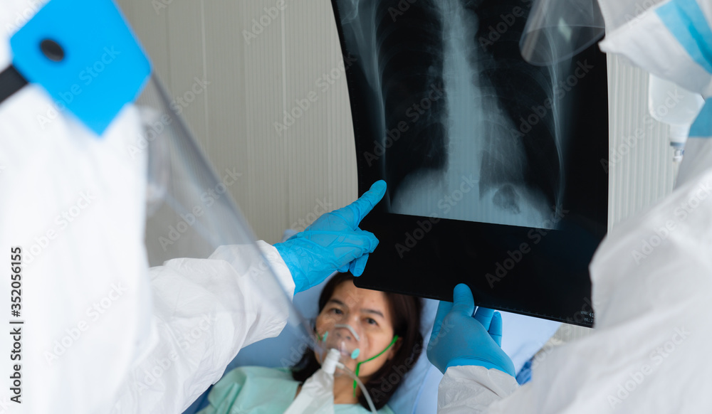 Foto de doctors in personal protective equipment or ppe looking at