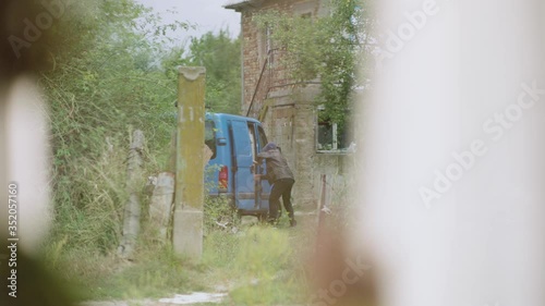POV of a neighbour seeing a kidnapper taking out the child from the blue ven. Child abduction scene