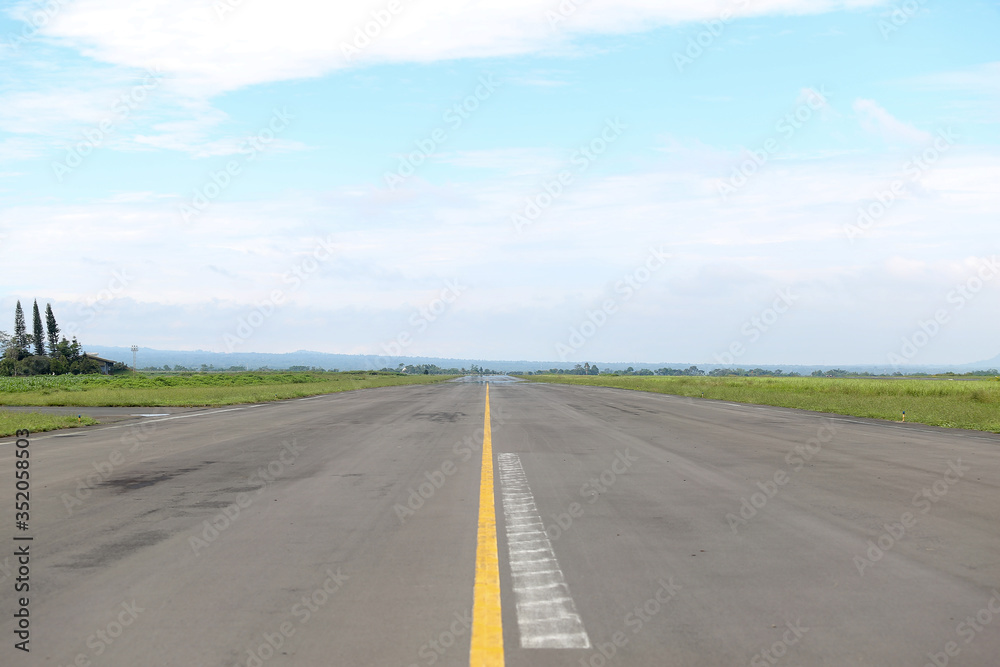 Airport runway airstrip in afternoon. Empty airport terminal with copy space