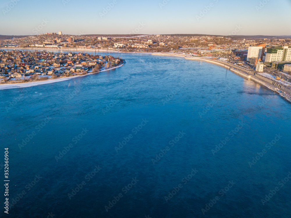 Aerial view of Angara river flows through city of Irkutsk the largest cities in Siberia, Russia. The Angara is the only river flowing from lake Baikal.