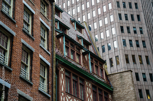 New York street. Manhattan downtown street. Empty streets of NYC. Rainy city. Sky rise buildings. Brown brick skyscrapers of New York City.  © tanya