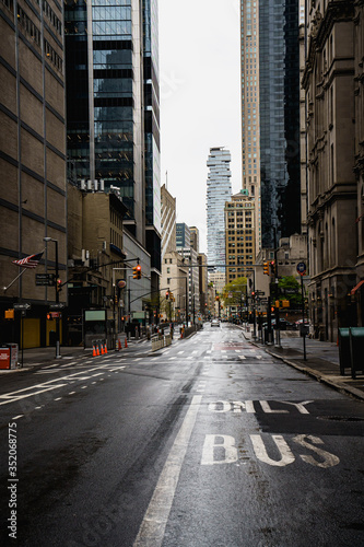 New York street. Manhattan downtown street. Empty streets of NYC. Rainy city. Sky rise buildings. Brown brick skyscrapers of New York City. 