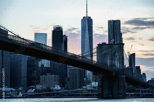 New York night panorama. Brooklyn Bridge and New York City skyline. Manhattan skyline. Skyscrapers buildings. New York City night lights.  © tanya