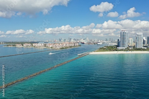 Aerial view of Fisher Island, South Pointe and Government Cut with City of Miami skyline and Port Miami in background. © Francisco