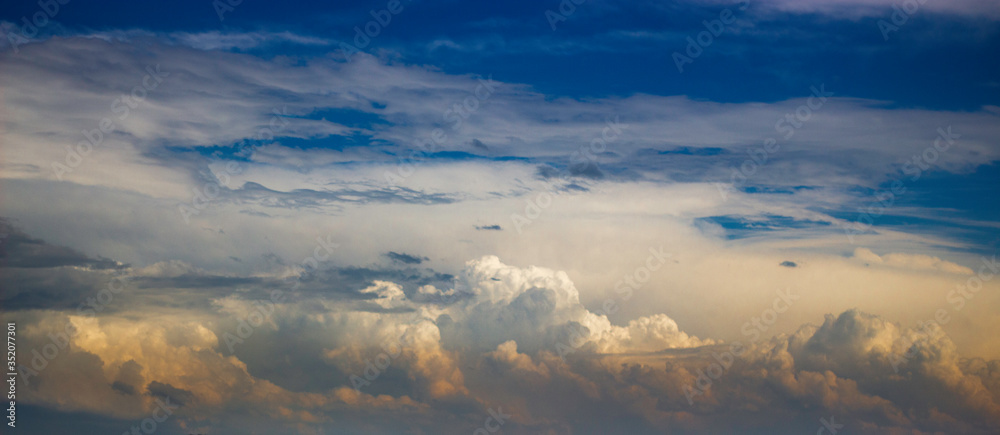 Obraz premium Cumulonimbus Clouds of a Massive Supercell Thunderstorm near Sunset in May