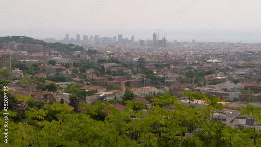 Aerial lockdown shot of cityscape against sky on sunny day - Barcelona, Spain Aerial lockdown shot of cityscape against sky on sunny day - Barcelona, Spain