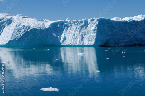 Iceberg and ice from glacier in Greenland. Arctic nature landscape. Global warming concept.
