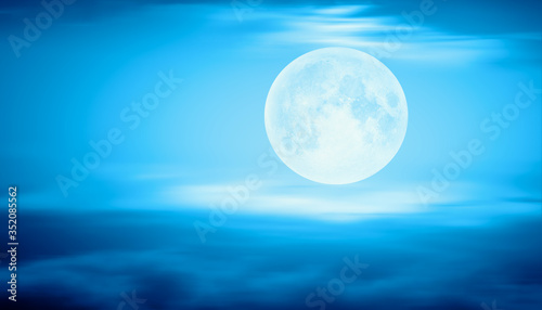 Full moon rising over empty ocean at night with power wave  Elements of this image furnished by NASA 