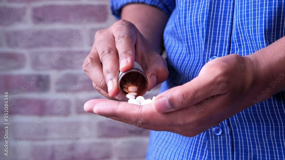 young man hand's taking medicine, close up young man hand's taking medicine, close up