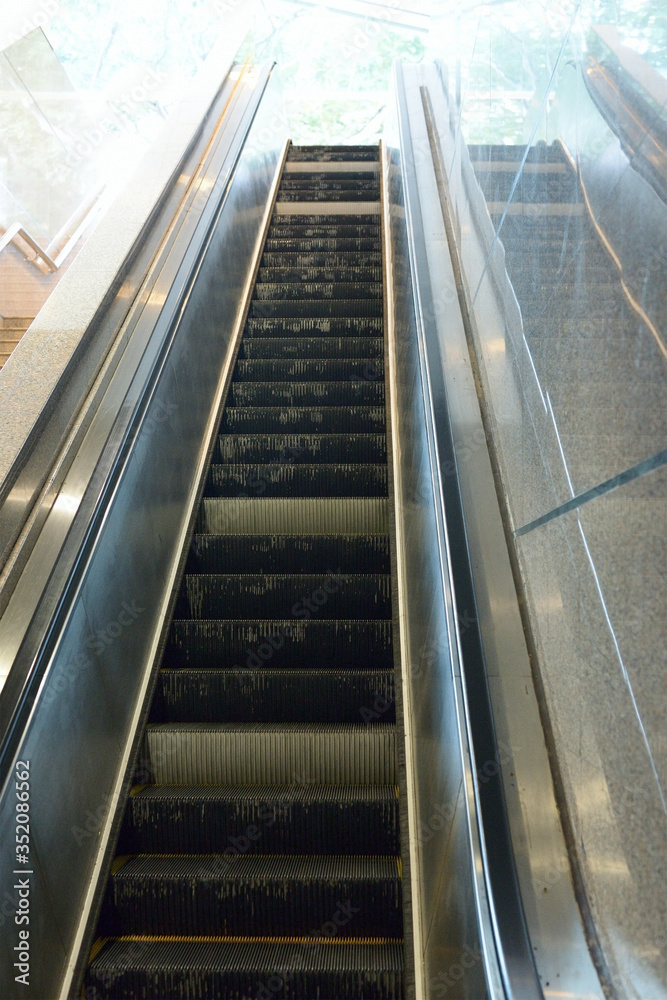 escalator in the underpass, the view from the bottom up escalator in the underpass, the view from the bottom up