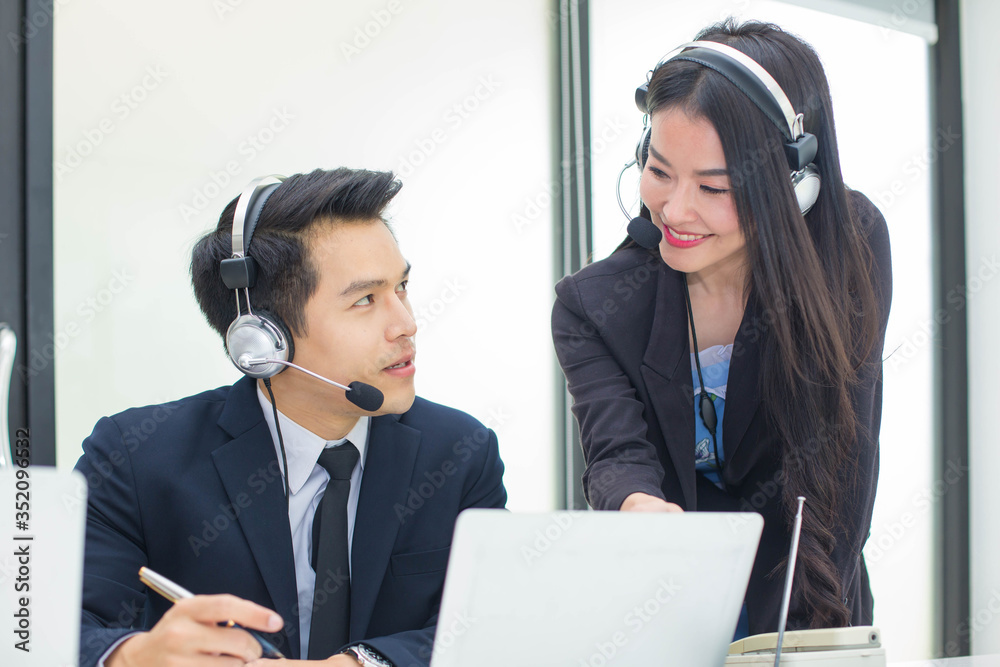 Asian call center staff. Call to talk to customers with friendly service and beautiful talk. Smile with friendly service. Asian call center staff. Call to talk to customers with friendly service and beautiful talk. Smile with friendly service.