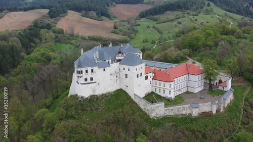 Aerial view of castle Slovenska Lupca, Slovakia, and surrounding landscape photo