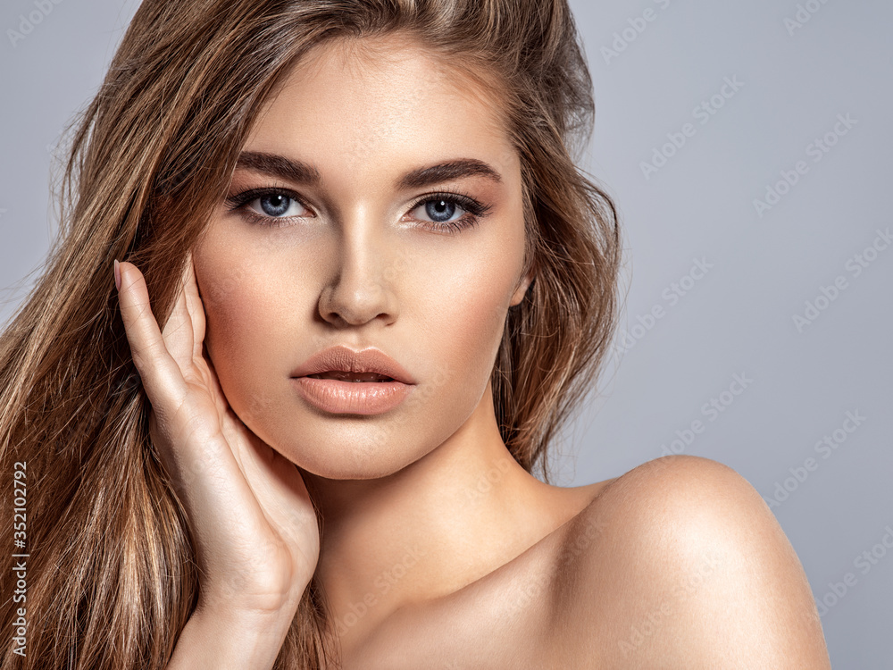 Woman with beauty long brown hair and natural makeup Woman with beauty long brown hair and natural makeup