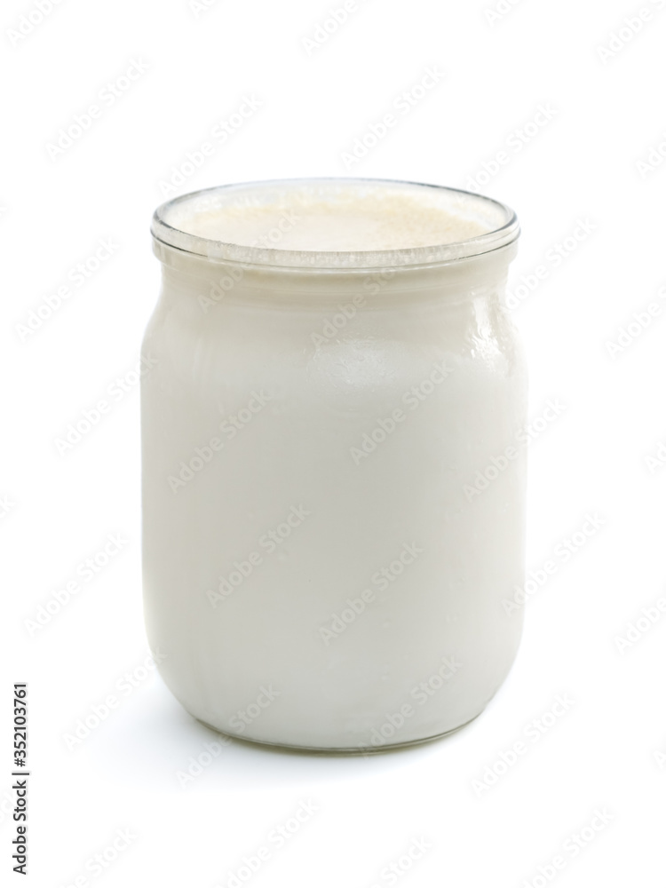 Georgian matsoni yoghurt in a glass pot isolated on white background Georgian matsoni yoghurt in a glass pot isolated on white background