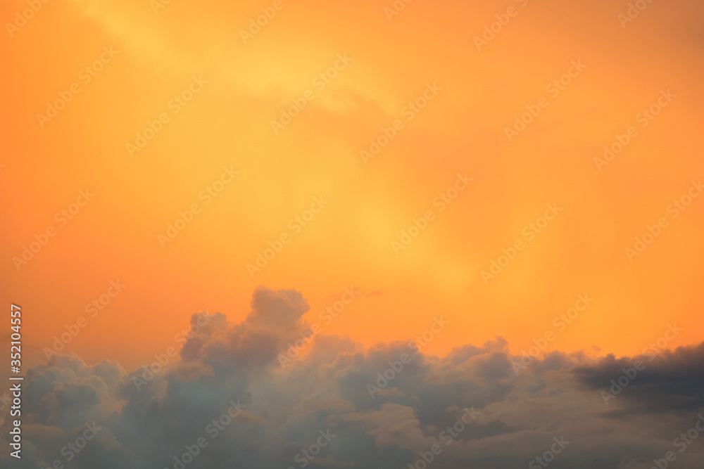 Fototapeta premium Orange sky and white clouds