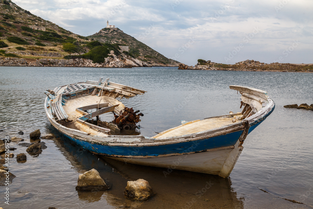 Abandoned boat at the ruins of Knidos ancient city and port, Turkey Abandoned boat at the ruins of Knidos ancient city and port, Turkey