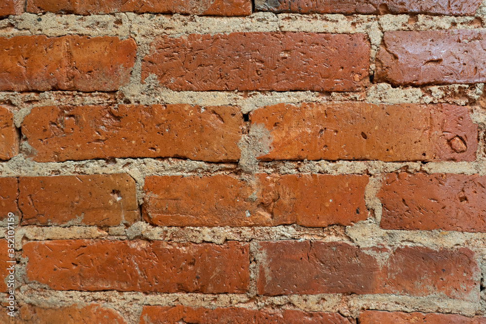 Old brick wall, old texture of red stone blocks closeup Old brick wall, old texture of red stone blocks closeup