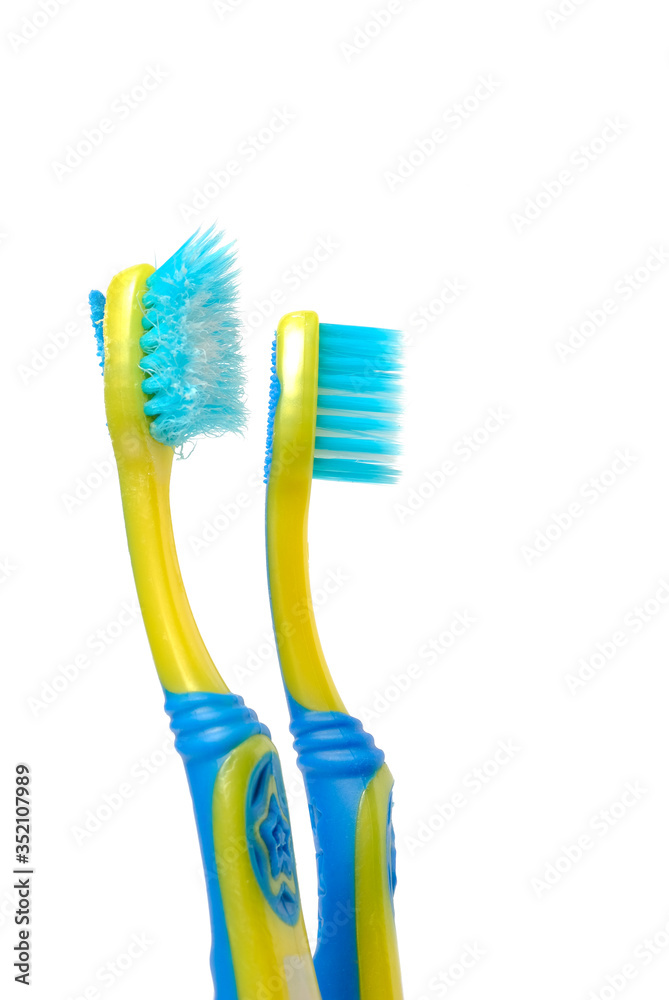 Old child toothbrush and new toothbrush on blue background Old child toothbrush and new toothbrush on blue background