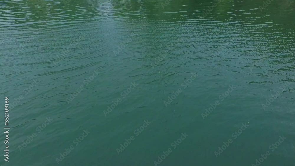 Aerial: Tilt up shot of beautiful waterfall in river, drone flying over water in forest - Krka, Croatia Aerial: Tilt up shot of beautiful waterfall in river, drone flying over water in forest - Krka, Croatia