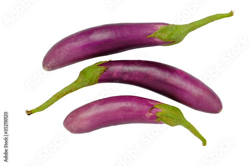 Top view of solid and sliced eggplant on a white background