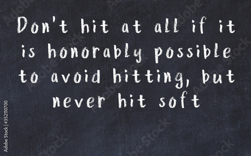 Chalk wise inscription on black chalkboard photo