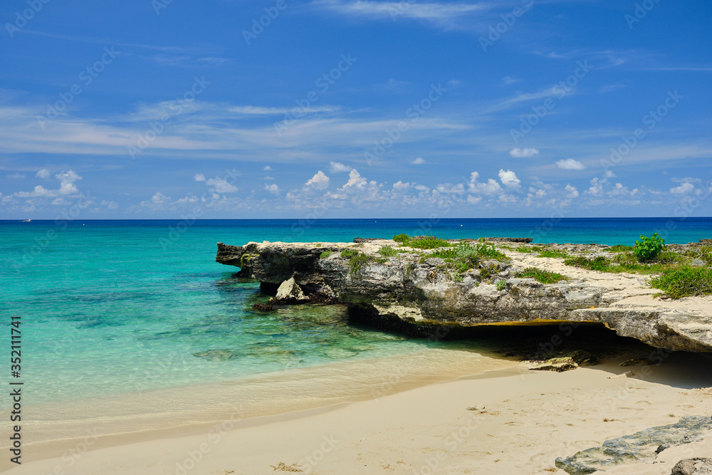 Small beautiful cove and crystal clear waters near Georgetown in the Cayman Islands Small beautiful cove and crystal clear waters near Georgetown in the Cayman Islands