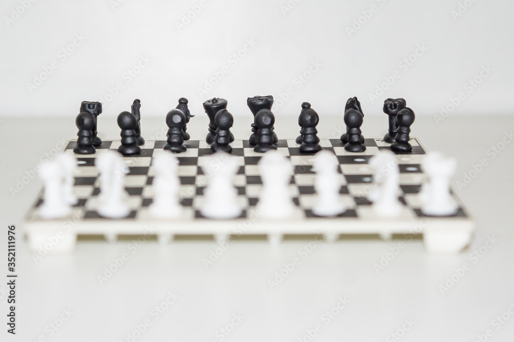 Chess board with figures on isolate white background.
Chess board with figures on isolate white background.