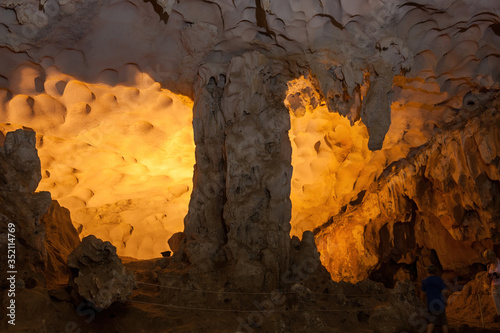 Stalactite and stalagmite formations in a limestone cave of Halong Bay, Vietnam