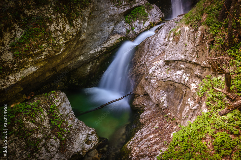 Beautiful Sum or Mostnica waterfall on the end of Voje valley in Slovenia