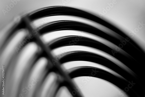 Black and white blurry image with abstract objects.