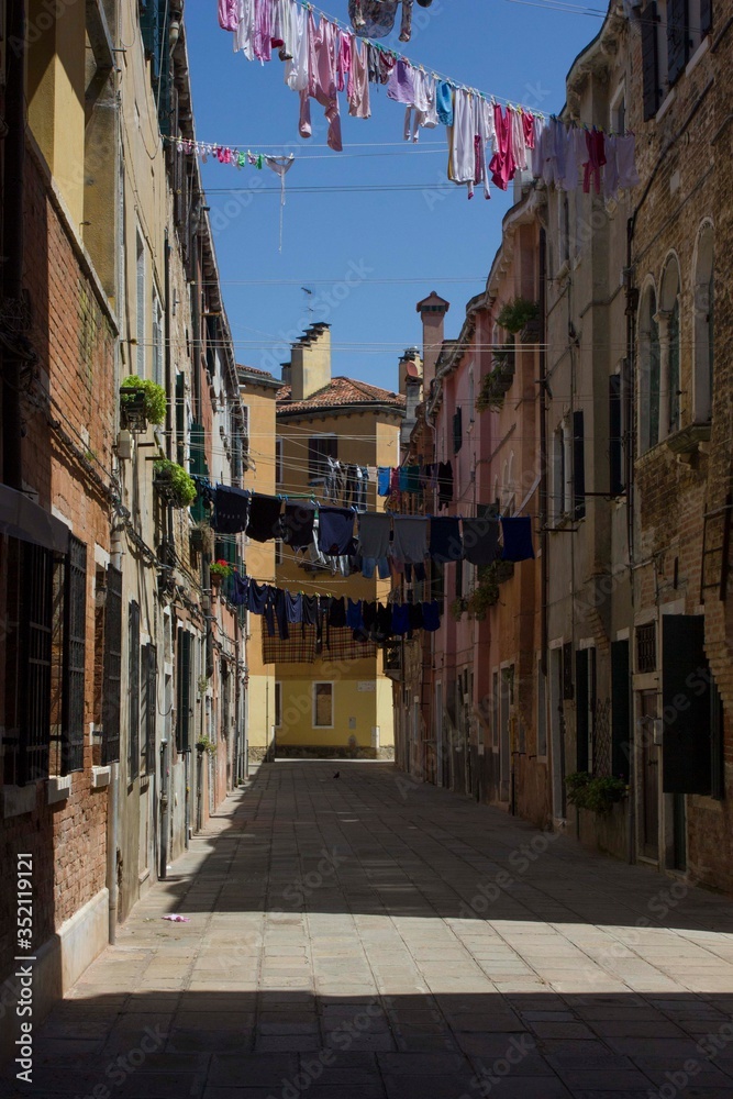 Ancient road in Venice with cloths hang out to dry