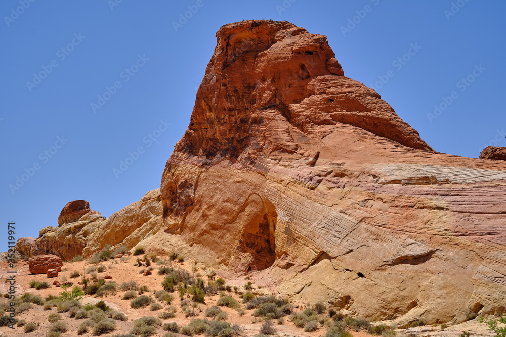 Large monoliths and smooth glacial carved rocks mark the Nevada Desert