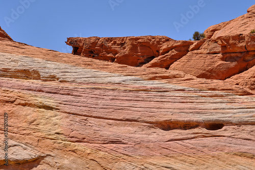 Red Aztec sandstone and other rocks form the colorful patterns in the Nevada Desert
