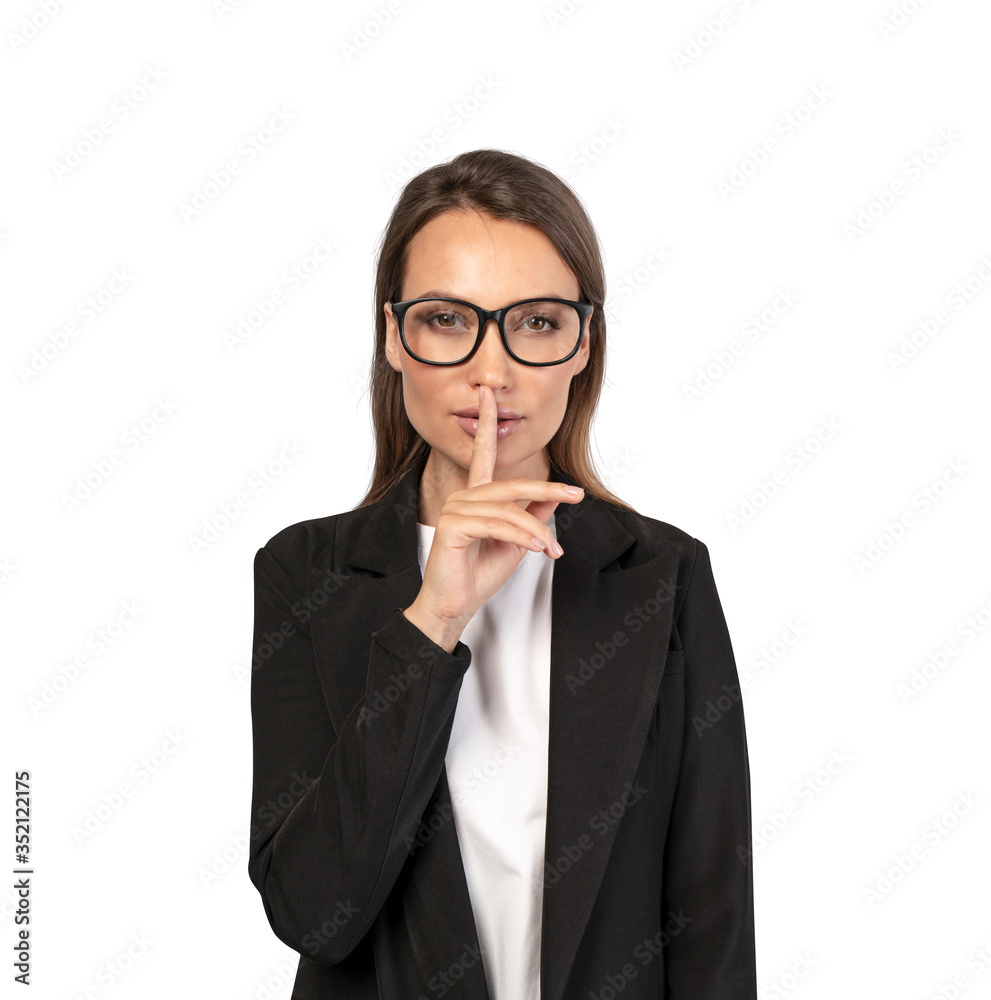 Businesswoman in glasses making hush sign Businesswoman in glasses making hush sign