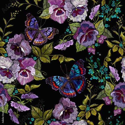 Violet flowers, meadow herbs and coloful butterflies. Seamless pattern. Embroidery. Botanical background. Summer garden art. Fashion template for clothes, textiles, t-shirt design